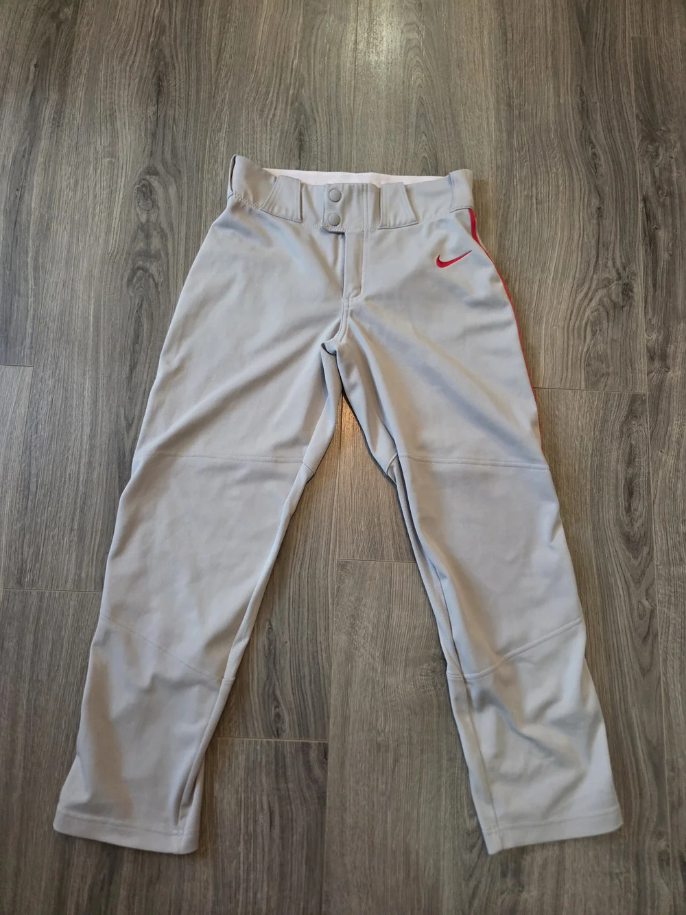Nike Light Gray Baseball Pants with Red Swoosh Accent